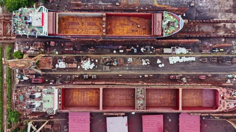 Construction of ships taking place at a shipyard in an industrial area with two Video stock 341376125