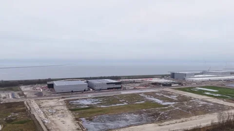 Construction At Shoreline Underway, Seaside Warehouse Project Progressing On Stock Footage 325453038