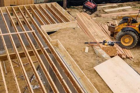 Construction showing massive solid wood joists construction forklift load... Foto stock