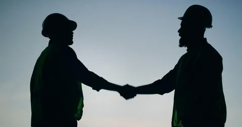 Construction silhouette, team or engineer with handshake for welcome, sky o.. Stock Photos