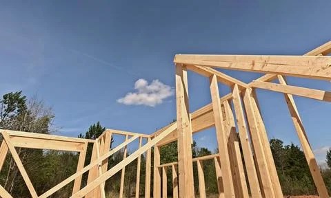 Construction site is abuzz with activity as during install wooden framing for Stock Photos
