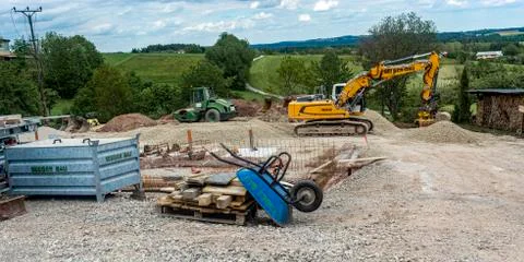 Construction site. an accelerator, a skating rink, a hand cart Stock Photos