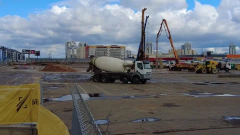 Construction site activity in an urban area during the day with a cement mixer a 動画素材 337125381