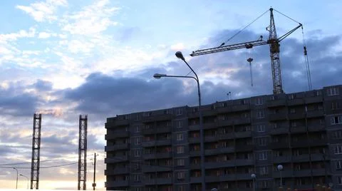 Construction site against the backdrop of a sunset sky Stock Photos
