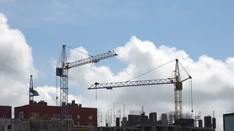 Construction site against a blue sky with floating clouds. Stock Footage