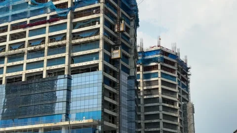 Construction Site with Alimak Hoist and Traffic 4K 60fps 스톡 동영상 338346341