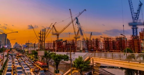 Construction site and busy traffic sunset Stock Footage 100858768