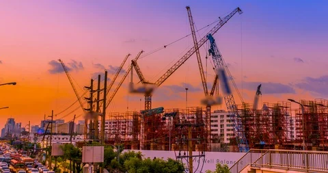 Construction site and busy traffic sunset. Stock Footage 100859175