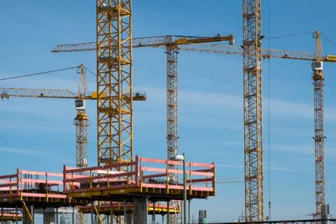 Construction site and cranes at work Stock Photos