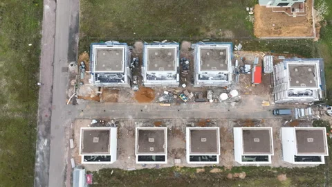 Construction site and large developing area - aerial view - panning shot Видео 247920928