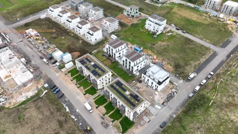 Construction site and large developing area - aerial view - panning shot Stock Footage 247921337