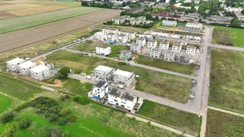 Construction site and large developing area - aerial view - panning shot Video stock 247921370