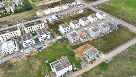 Construction site and large developing area - aerial view - panning shot Vidéo 247922167