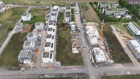 Construction site and large developing area - aerial view - panning shot Stock-Footage 247922273