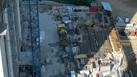 Construction site and workers. View from upper floors of building Stock Footage 152800343