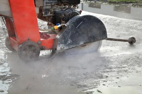 Construction site, asphalt cutting tool at road construction site Stock Photos