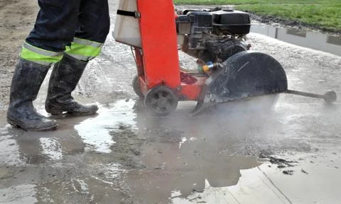 Construction site, asphalt cutting tool at road construction site Stock Photos
