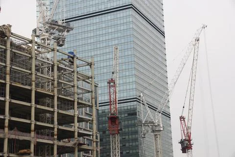 Construction site background. Crane and building. Industrial background. Stock Photos