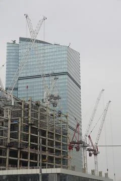 Construction site background. Crane and building. Industrial background. Stock Photos