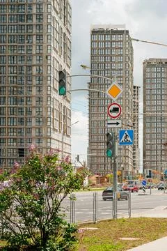 Construction site background. Hoisting cranes and new multi-storey buildings. Stock Photos