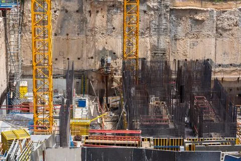 Construction site background. Hoisting cranes and new multi storey buildings Stock Photos