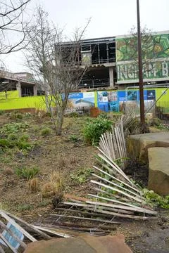 Construction Site, Bare Trees, And Urban Garden With Mural In Nottingham, Stock Photos