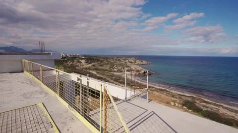 Construction site for beach villa progresses along shoreline. Workers build Stock Footage 268620742