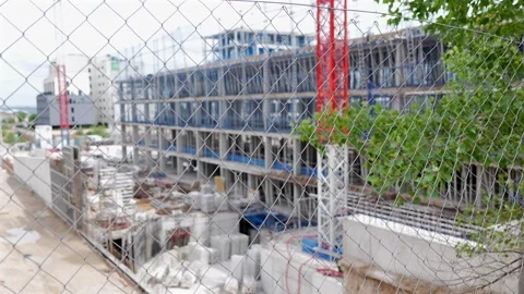 Construction site behind chain link fence in Madrid Stock-Footage 334115848