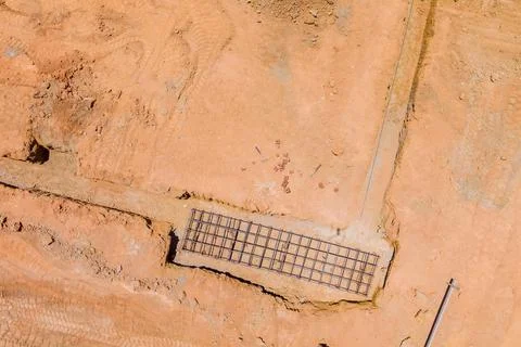 A construction site is being prepared with dug trench under a concrete Foto stock