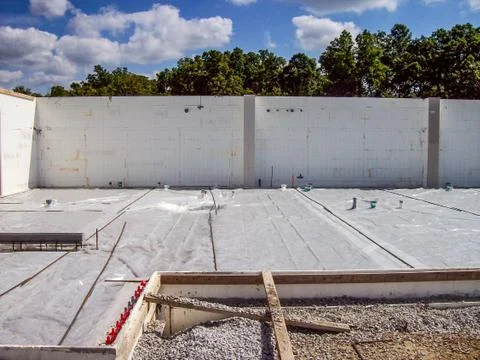Construction site for a berm home with forms in place for pouring the concret Foto stock