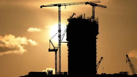Construction Site with Big Tower Crane in Silhouette, Stock Footage 236976203