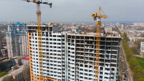 Construction site with a bird's eye in a megacity.Building in the city.Big crane Stock Footage 89400161