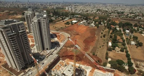 Construction site with a bird's eye on Sunset Tower crane, excavator and sand Stock Footage 91356989