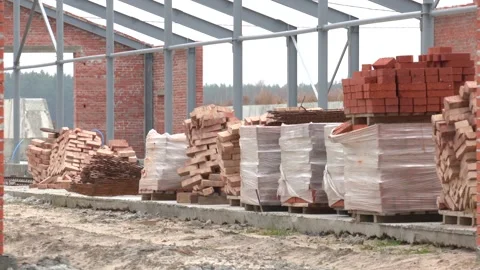 Construction site. Bricks from construction site. Pile of red bricks 스톡 동영상 165637249