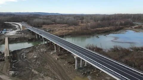 Construction site of a bridge across the road . Bird eye. big faucet. Aerial Stock Footage 230433817