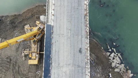 Construction site of a bridge across the road . Bird eye. big faucet. Aerial Video stock 231439349