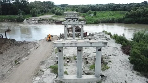 Construction site of a bridge across the road . Bird eye. big faucet. Aerial Stock Footage 232267006