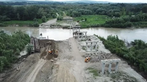 Construction site of a bridge across the road . Bird eye. big faucet. Aerial 스톡 동영상 232806859