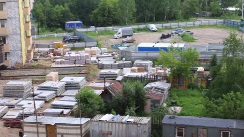 Construction site with building materials, part of crane at summer day Stock Footage 81232055