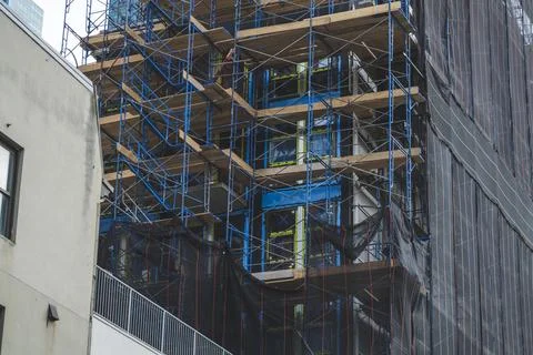 Construction site building under construction: concrete and wood structure and Stock Photos