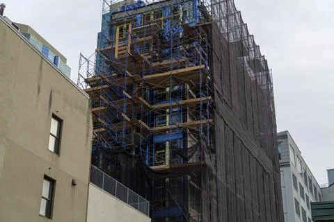 Construction site building under construction: concrete and wood structure and Stock Photos