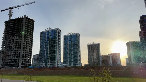 Construction site with buildings under construction. Tower cranes in action. Stock Footage 275347137