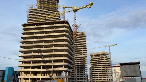 Construction site with buildings under construction. Tower cranes in action. Stock Footage 275347524