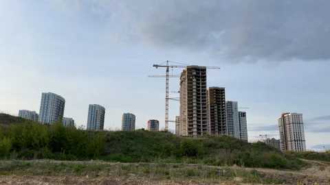 Construction site with buildings under construction. Tower cranes in action. Stock Footage 275347772