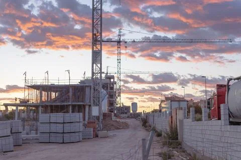 Construction site with buildings under development and tower cranes working.. Stock Photos