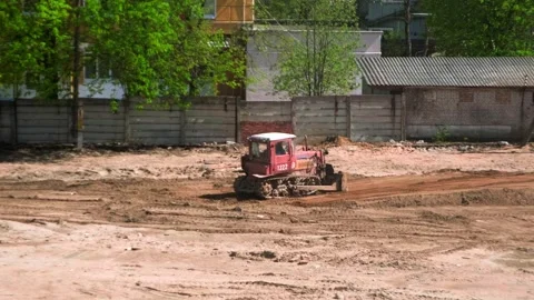 Construction site, bulldozer clears the road Stock Footage 241943769