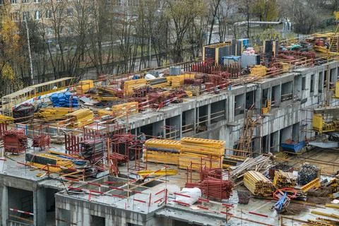 Construction Site Bustling With Activity Showcasing Building Materials and Stock Photos
