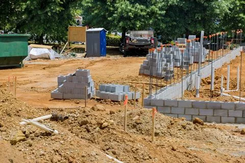 In a construction site, cement blocks stacked for the purpose of being laid on a Stock Photos