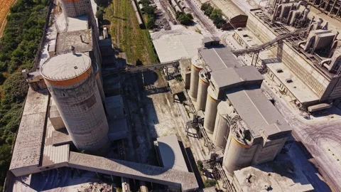 Construction site with cement silos and building materials in daylight Stock Footage 340382479