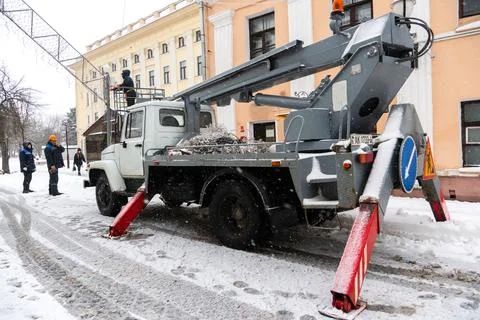 Construction site in the city in winter. Workers work at the facility in th.. Stock Photos
